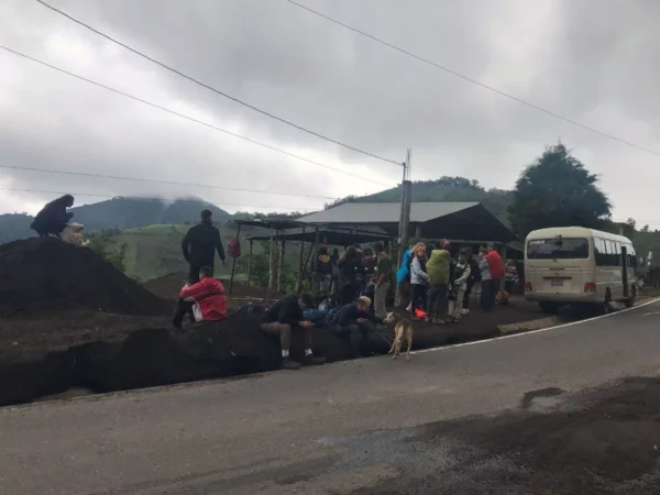hikers getting ready for trek at trailhead of volcan acatenango