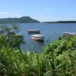 A view of Lagoa da Conceição and idle passenger boats along the hiking trail of costa da lagoa