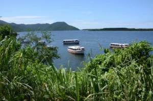A view of Lagoa da Conceição and idle passenger boats along the hiking trail of costa da lagoa