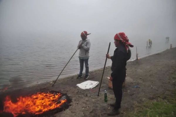mam maya boys lighting fire on shore of lake chicabal