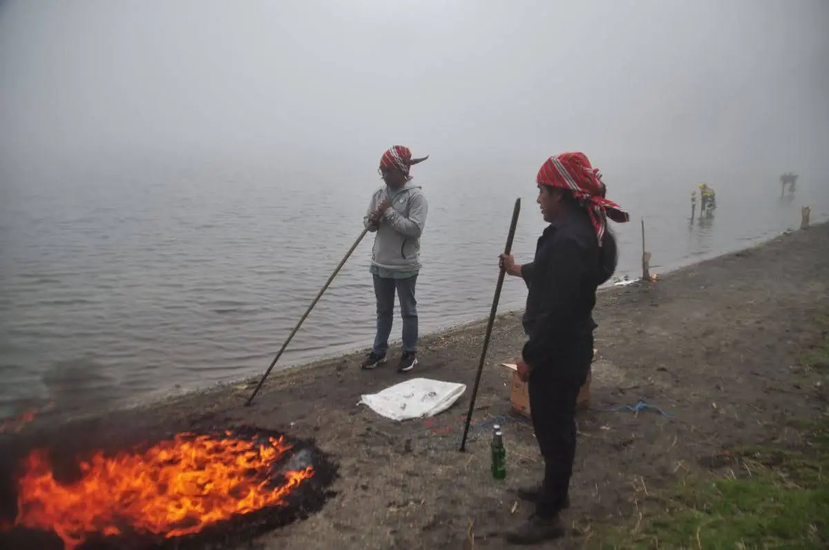 mam maya boys lighting fire on shore of lake chicabal