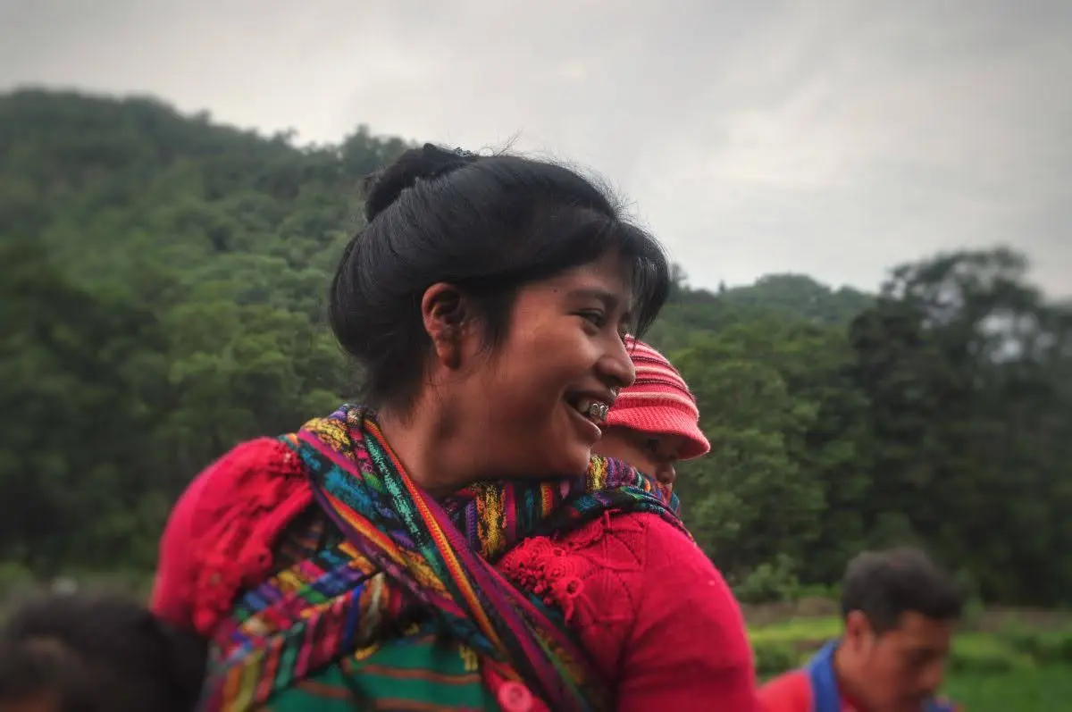 mam maya woman with a baby on her back