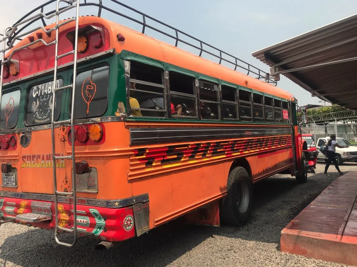 orange chicken bus in Malacatán bus station in guatemala