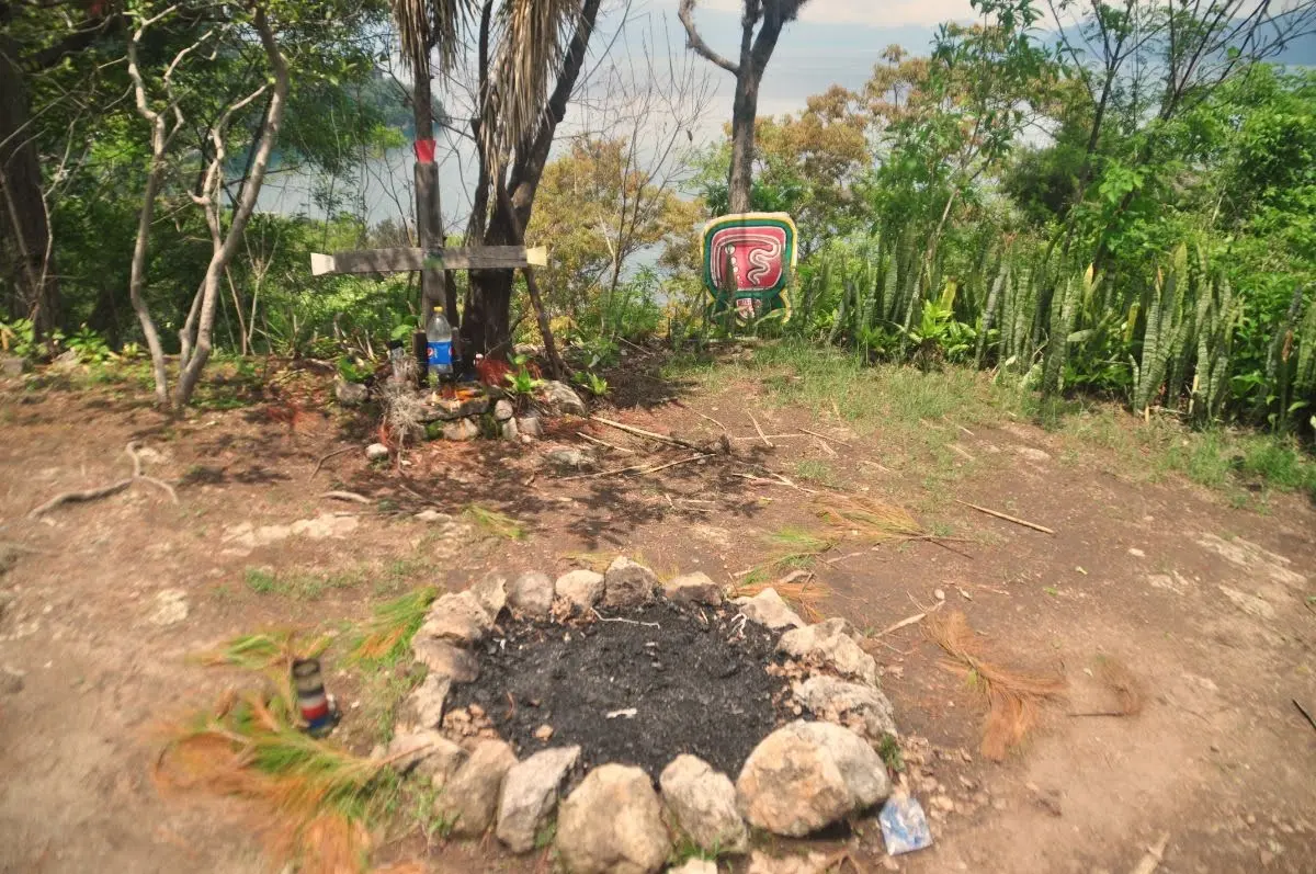 Fire leftovers and offerings on hill above san larcos la laguna, lake atitlan