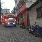 Chicken bus maneuvering through the streets of San Pedro La Laguna on shore of lake atitlan