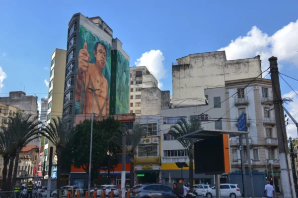 Native American giving a thumbs-up in one of many building-sized murals of São Paulo
