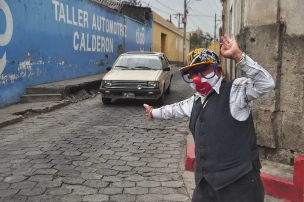 Volunteer traffic controller/clown at a junction in Xela