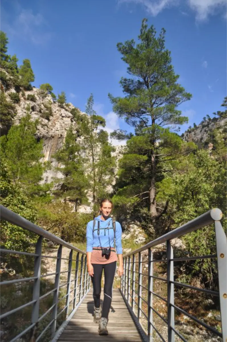 crossing a bridge while hiking a agali gorge on evia island