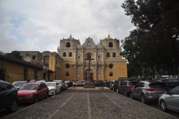 La Merced Church in Antigua Guatemala viewed from its cobblestone plaza.