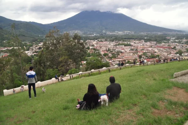 View of Antigua Guatemala from Cerro de la Cruz with Volcán de Agua rising above the colonial city.