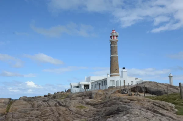 lighthouse on rocky coast in cabo polonio, uruguay