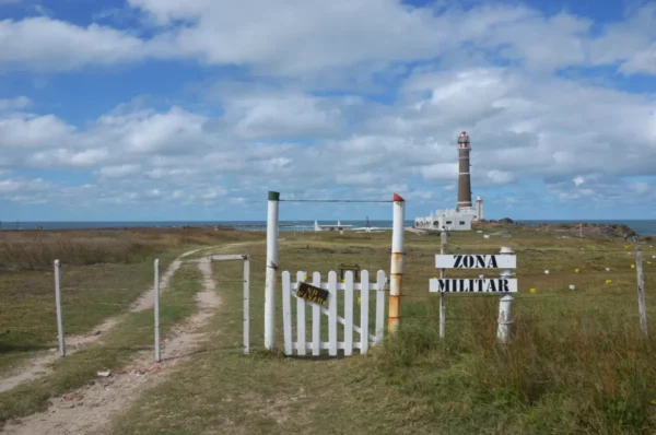 The lighthouse beyond military zone gate of cabo polonio