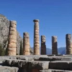 thick standing columns of the temple of apollo in delphi, greece