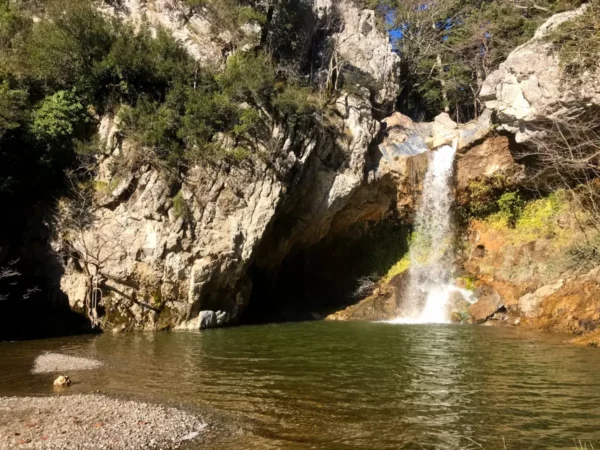 Drymonas Waterfall cascading into a natural pool in Northern Evia