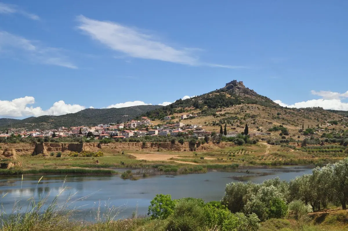 View of fylla castle of evia island from below across the lake and fylla village