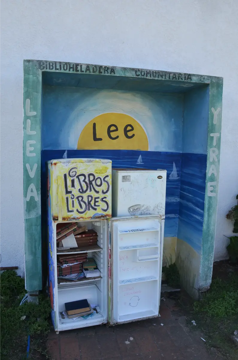 Old fridge turned community bookshelf in la paloma, uruguay