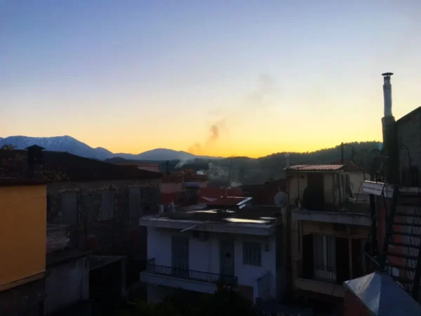 View of the mountains rising above the rooftops of Mantoudi, Evia, Greece.