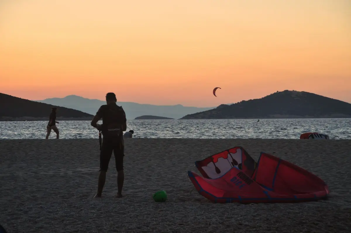 kitesurfers at Dusk at Megali Ammos beach in south evia