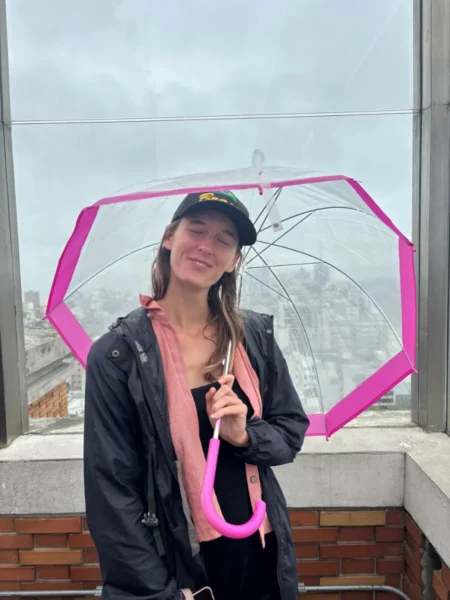 girl with pink umbrella in panoramic viewpoing of montevideo