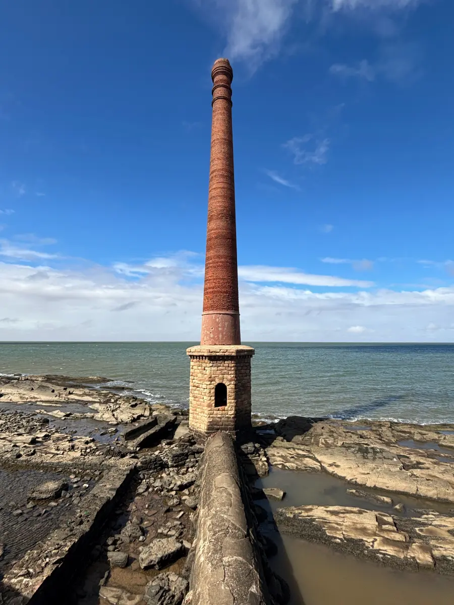the Old Sewer Vent of montevideo, big odd chimney on the coast