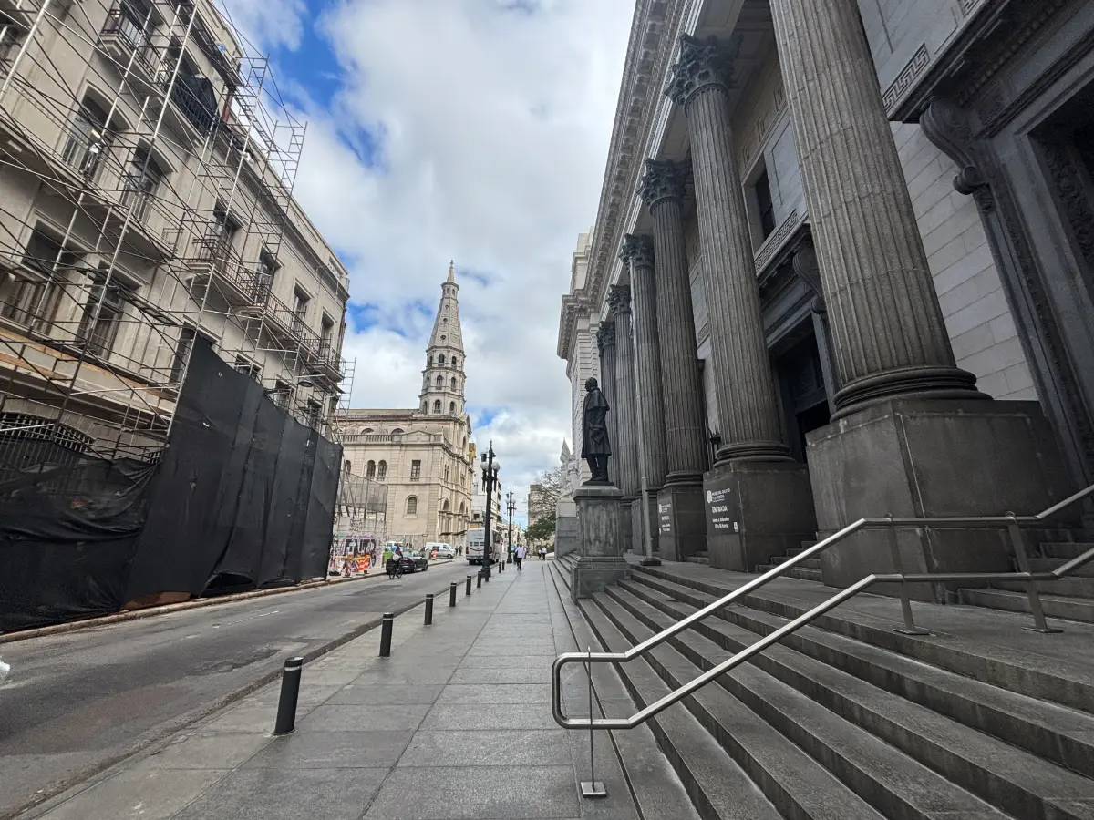 Entrance of Gaucho and Currency Museum with the tower of Saint Francisco de Asís Church in the background