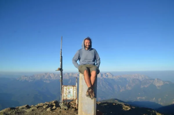 On the summit of mount smolikas with Mount Tymfi in the background