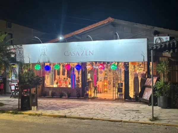 Colorful lanterns illuminate the Casa Zen shop exterior at night in Praia do Rosa, Santa Catarina, Brazil.