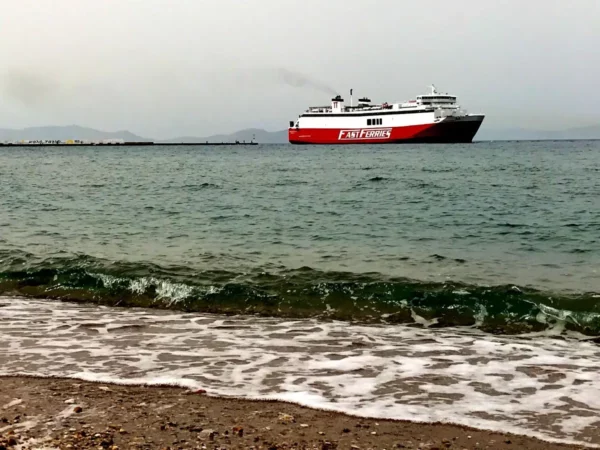 red-white ferry leaving rafina port near athens