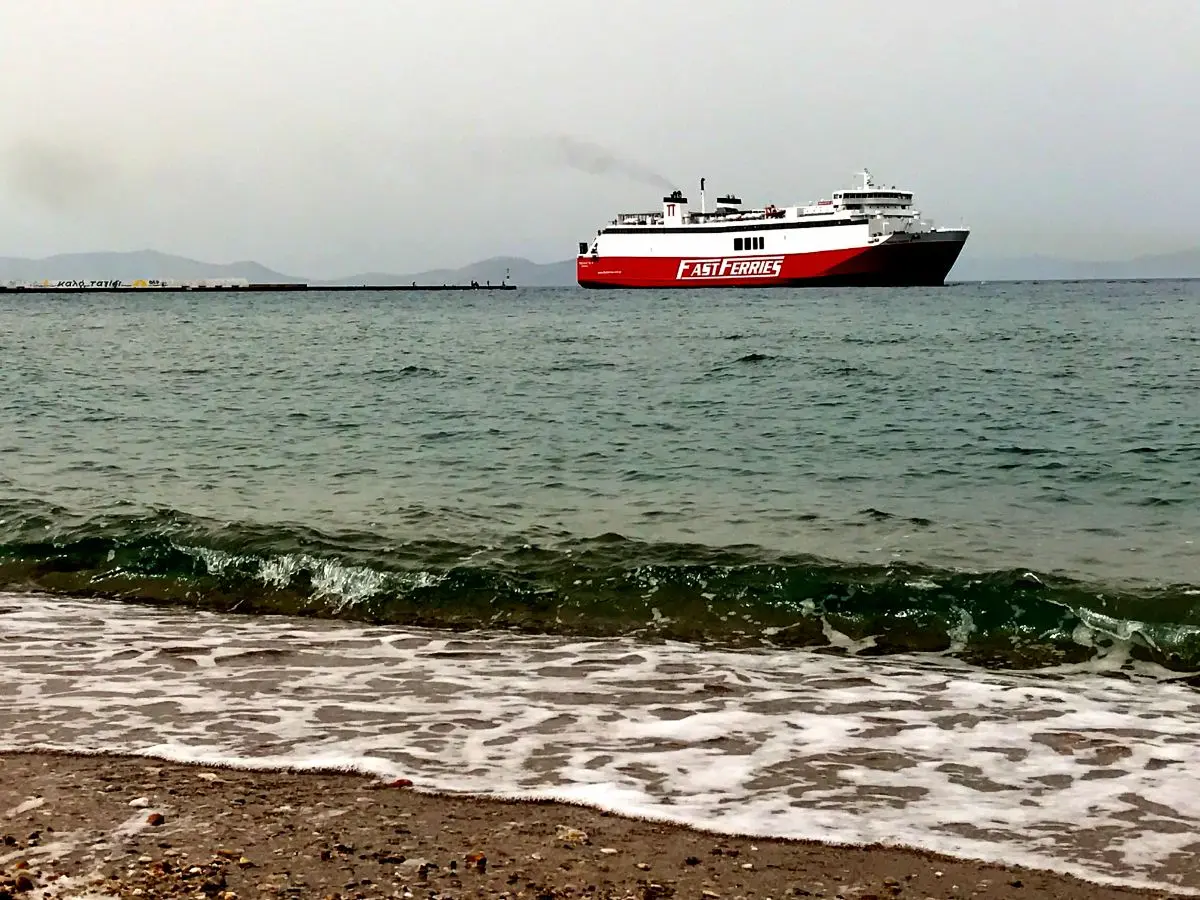 red-white ferry leaving rafina port near athens