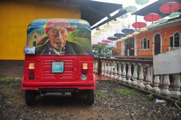 Artistic tuk-tuk with mural of indigenous man in San Juan la laguna at lake atitlan