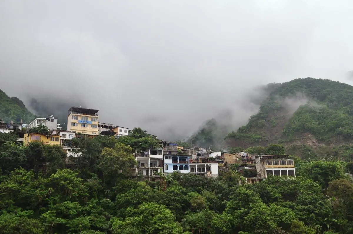 the upper village of santa cruz at lake atitlan engulfed by mist and vegetation