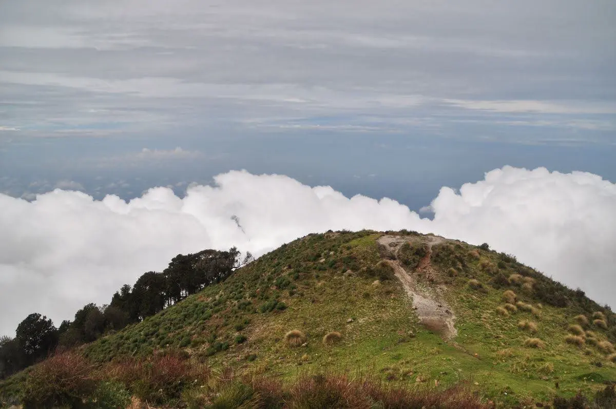 view of thick clouds below the summit of santa maria volcano in guatemala