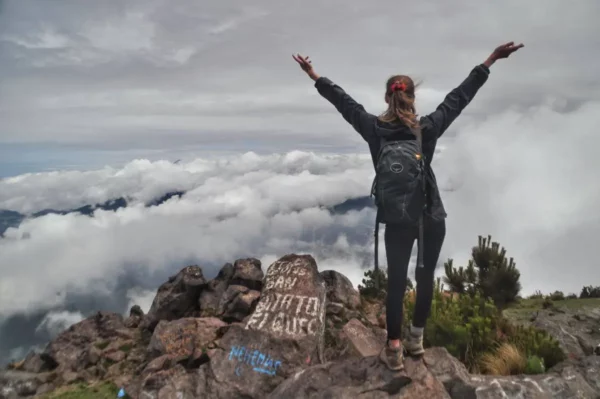 girl hiker On top of Santa María Volcano in guatemala