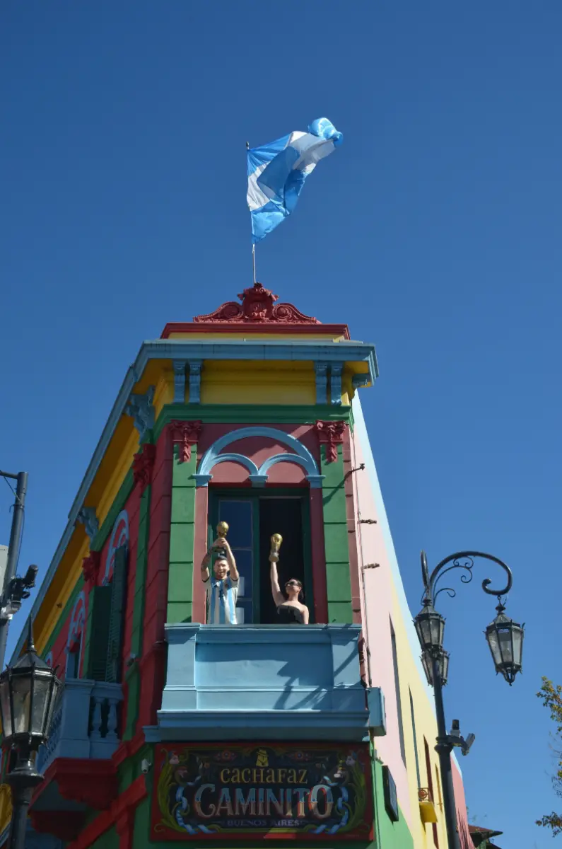 A celebratory Messi mannequin overlooking the caminito in boca, buenos aires