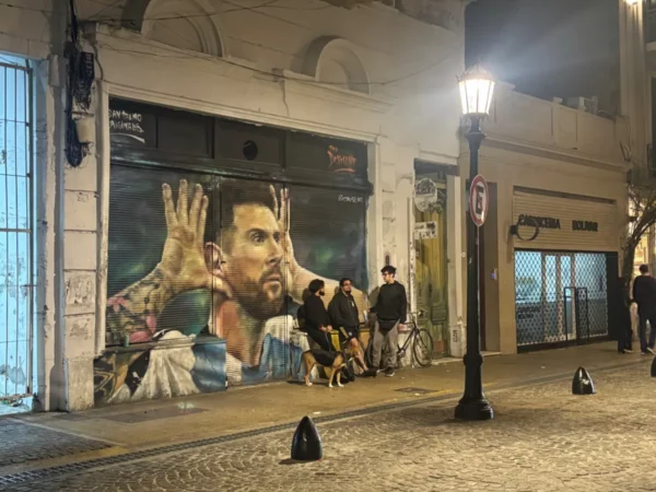 mural of messi with his hands behind his ears in san telmo, buenos aires