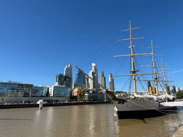 Tall ship docked at Puerto Madero with skycrapers in the background