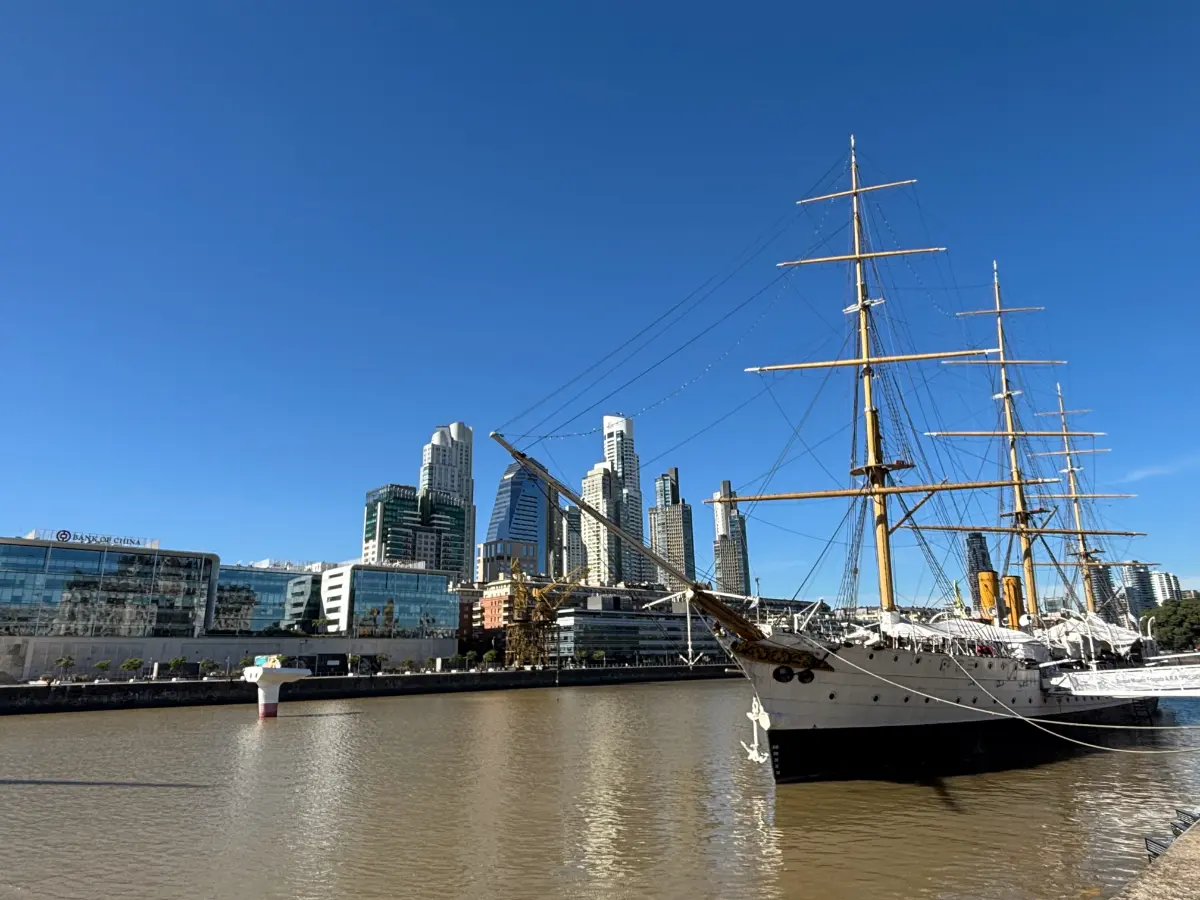 Tall ship docked at Puerto Madero with skycrapers in the background