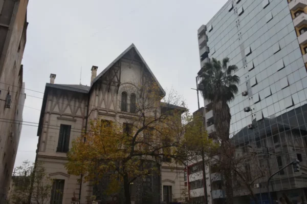 Historic architecture contrasts with modern buildings in Córdoba, Argentina, showcasing a blend of styles and colors.