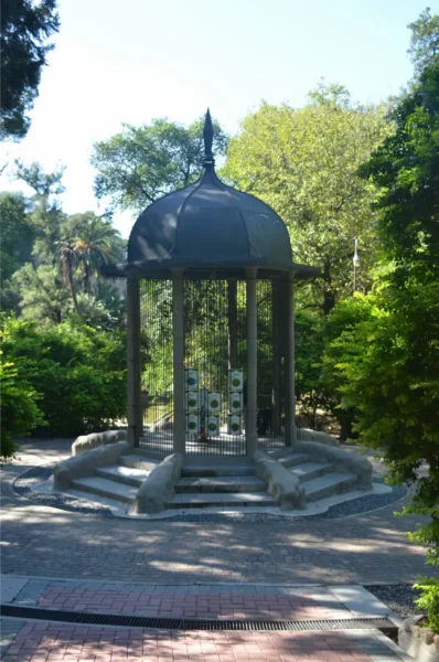 Historic gazebo surrounded by lush greenery in Córdoba, Argentina, showcasing a peaceful spot for relaxation.