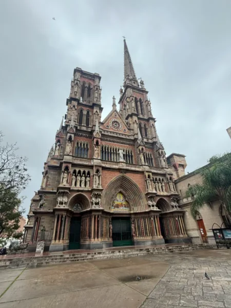 Stunning architecture of the historic Torre Angela, showcasing intricate details and a tall spire in Córdoba, Argentina.