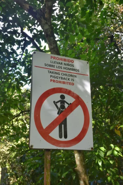 sign prohibiting piggyback in iguazu national park, argentina