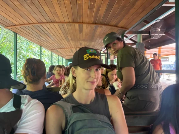 girl with brazil hat on the tourist train in iguazu national park in argentina