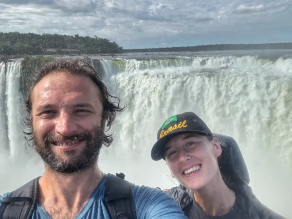couple selfie at devil's mouth of iguazu falls in argentina