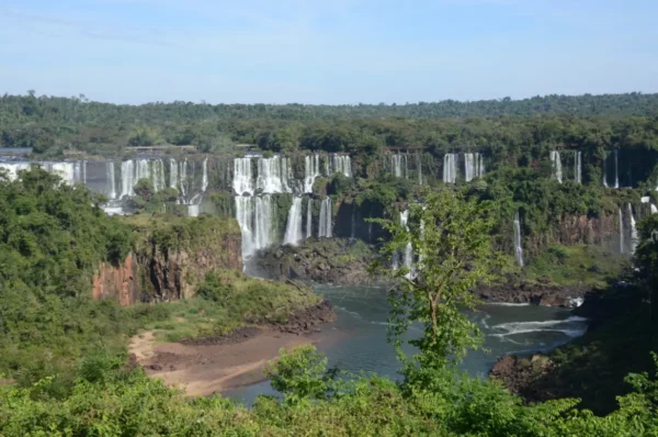 A sweeping westward view of iguazu falls on the Argentinian side from the hiking trail in brazil