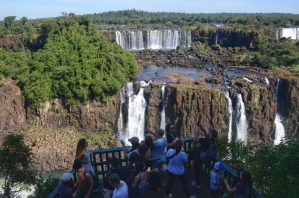 Crowded viewpoint of iguazu falls in brazil