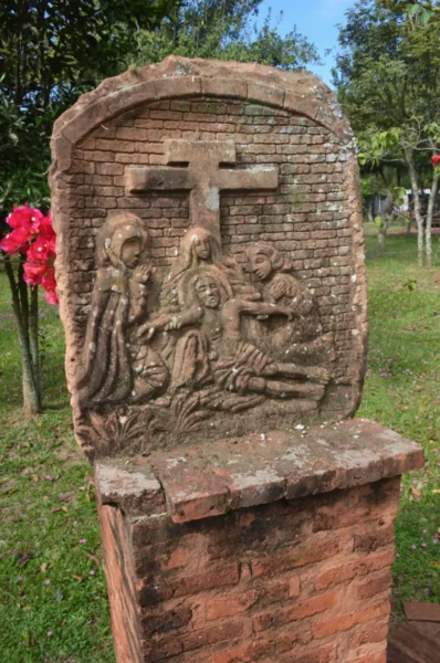 Brickwork depicting Jesus’s deposition in la santisima trinidad de parana jesuit ruins in paraguay