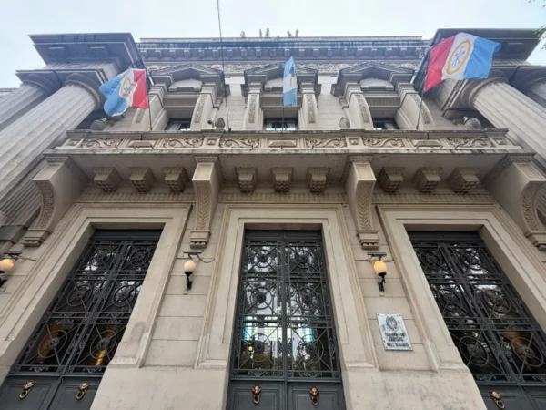 Historic architecture featuring decorative elements and flags in Rosario, Santa Fe, Argentina.