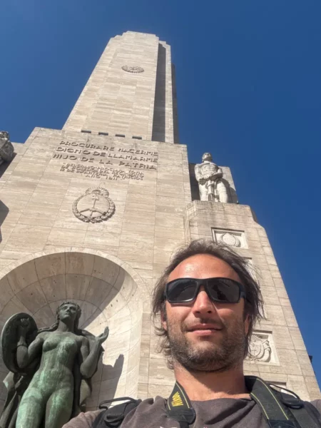 Monument to the Flag stands tall in Rosario, Santa Fe, Argentina, featuring a statue and a clear blue sky above.