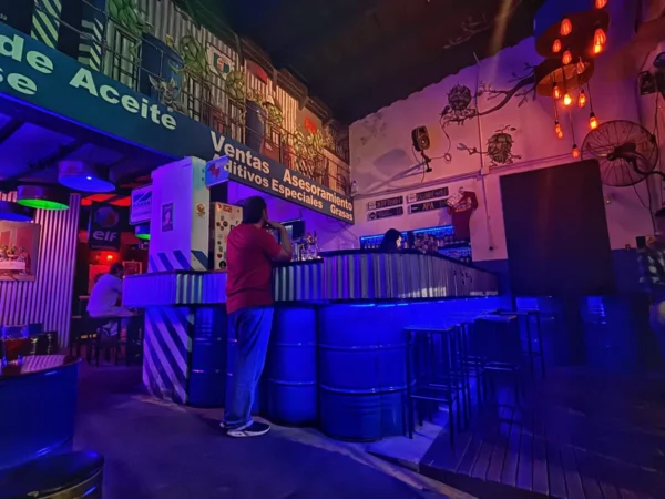 Vibrant bar scene in Rosario, with colorful lighting, unique decor, and patrons enjoying the lively atmosphere.