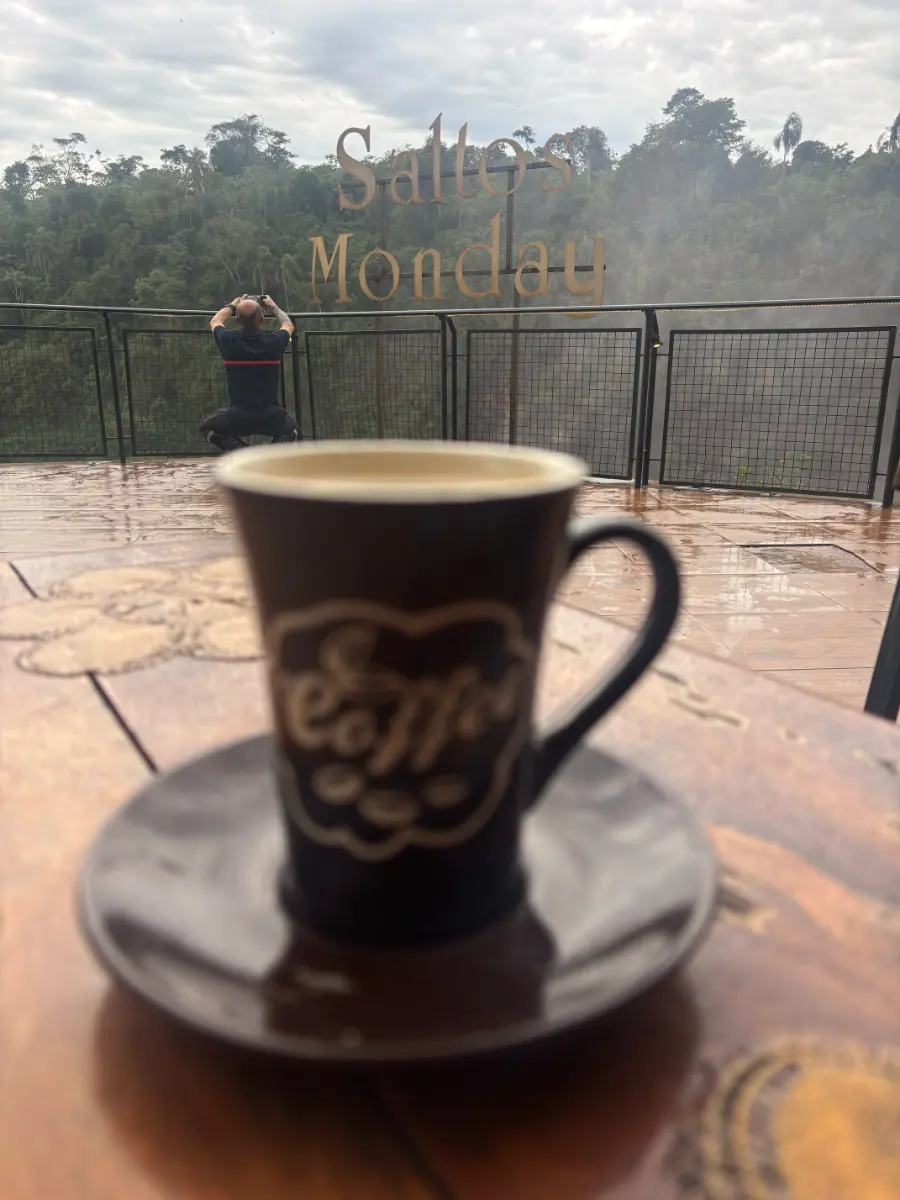 cup of coffee with a view of saltos monday sign in paraguay